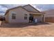 Home exterior featuring a covered patio and ample backyard space at 9520 W Trumbull Rd, Tolleson, AZ 85353