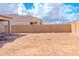 Spacious backyard with block wall, ready for landscaping at 9520 W Trumbull Rd, Tolleson, AZ 85353