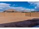 Large backyard enclosed by a block wall, offering privacy at 9520 W Trumbull Rd, Tolleson, AZ 85353