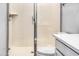 Clean and modern bathroom featuring a glass-enclosed shower and a toilet at 9520 W Trumbull Rd, Tolleson, AZ 85353