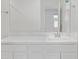 Bright bathroom with a white vanity and mirror at 9520 W Trumbull Rd, Tolleson, AZ 85353
