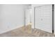 Bedroom featuring carpet flooring and a double door closet at 9520 W Trumbull Rd, Tolleson, AZ 85353