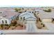 Charming single-story home with a two car garage, desert landscaping, and a cozy front porch at 9520 W Trumbull Rd, Tolleson, AZ 85353