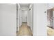 Long hallway with tile flooring leading to several rooms at 9520 W Trumbull Rd, Tolleson, AZ 85353