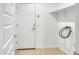Laundry room with tile flooring and shelving at 9520 W Trumbull Rd, Tolleson, AZ 85353