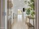 Open-concept living space featuring neutral tiling, high ceilings, and bright natural light at 9520 W Trumbull Rd, Tolleson, AZ 85353