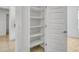 Open pantry featuring multiple shelves that offer ample storage and organizational solutions at 9520 W Trumbull Rd, Tolleson, AZ 85353