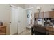 Hallway featuring a view into the kitchen, with double doors and a built-in desk area at 10188 E Rugged Mountain Dr, Gold Canyon, AZ 85118