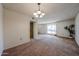 Open dining area featuring neutral walls and carpeted floors at 10326 W Pleasant Valley Rd, Sun City, AZ 85351