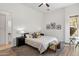 Comfortable bedroom featuring a neutral color palette, wood floors, and serene decor at 10883 E La Junta Rd, Scottsdale, AZ 85255