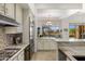 A modern kitchen featuring stainless steel appliances, granite countertops, and an open-concept design at 10883 E La Junta Rd, Scottsdale, AZ 85255
