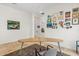Bright office space with unique art and a large desk, perfect for a productive work environment at 10883 E La Junta Rd, Scottsdale, AZ 85255