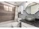 This renovated bathroom is a modern oasis with new tile, fixtures, and plenty of storage at 11333 N 92Nd St # 2028, Scottsdale, AZ 85260