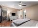 A tranquil bedroom showcases a stylish dresser, soft carpet, and a comfortable bed at 11333 N 92Nd St # 2028, Scottsdale, AZ 85260