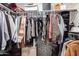 A walk-in closet is neatly organized, providing ample storage for clothing and accessories at 11333 N 92Nd St # 2028, Scottsdale, AZ 85260