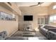Open living room featuring modern decor, a ceiling fan and large windows overlooking the backyard at 11333 N 92Nd St # 2028, Scottsdale, AZ 85260