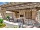Covered patio features nice outdoor seating, a fireplace and desert landscaping at 11333 N 92Nd St # 2028, Scottsdale, AZ 85260