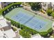 Aerial view of a well-maintained tennis court surrounded by lush landscaping at 11333 N 92Nd St # 2028, Scottsdale, AZ 85260