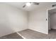 Cozy bedroom with neutral walls, plush carpet, and a ceiling fan at 1214 N 84Th Pl, Scottsdale, AZ 85257