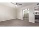 This bedroom features carpet floors, ceiling fan, and mirrored sliding closet doors at 1214 N 84Th Pl, Scottsdale, AZ 85257