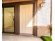 Inviting front entrance featuring a secure door and stylish exterior lighting fixture at 1214 N 84Th Pl, Scottsdale, AZ 85257