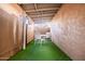 Outdoor patio space, includes a table with four chairs, astroturf and shade covering at 1214 N 84Th Pl, Scottsdale, AZ 85257