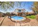 Expansive backyard featuring a pool, playset, and well-maintained landscaping for outdoor enjoyment at 1314 E Bluefield Ave, Phoenix, AZ 85022