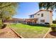 Spacious backyard featuring a well-manicured lawn, pool, and covered patio for outdoor living at 1314 E Bluefield Ave, Phoenix, AZ 85022