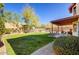 Lush backyard with a covered patio, providing an ideal space for outdoor entertaining and relaxation at 1314 E Bluefield Ave, Phoenix, AZ 85022
