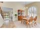 Dining area with wooden table, decorative hutch, and natural lighting at 1314 E Bluefield Ave, Phoenix, AZ 85022