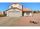 Charming home with a two-car garage, tile roof, and desert landscaping at 1314 E Bluefield Ave, Phoenix, AZ 85022