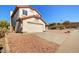 Beautiful two-story home with a well-maintained exterior, a two-car garage, and desert landscaping at 1314 E Bluefield Ave, Phoenix, AZ 85022