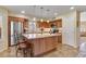 Modern kitchen with stainless steel appliances, island, and tile backsplash at 1314 E Bluefield Ave, Phoenix, AZ 85022