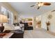 Open living space with views to kitchen and dining areas, and neutral carpeting at 1314 E Bluefield Ave, Phoenix, AZ 85022