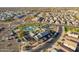 Stunning aerial view of a Primary-planned community with a beautiful pool and community center at 13568 N 144Th Dr, Surprise, AZ 85379