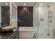 Modern bathroom features a separate glass shower, soaking tub and beautiful contemporary design at 13568 N 144Th Dr, Surprise, AZ 85379