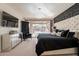 Stunning bedroom features a luxurious bed, stylish decor, and access to a private outdoor space at 13568 N 144Th Dr, Surprise, AZ 85379