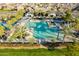 Get a bird's eye view of this community's sparkling pool, with palm trees and shade canopies at 13568 N 144Th Dr, Surprise, AZ 85379