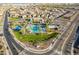 Stunning aerial view of the community pool area, featuring lush landscaping and recreational facilities at 13568 N 144Th Dr, Surprise, AZ 85379