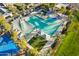 Capture this elevated view of the community's pristine pool, basketball court and lush green spaces at 13568 N 144Th Dr, Surprise, AZ 85379
