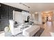 Stylish dining area with a glass-top table, upholstered chairs, and designer wallpaper at 13568 N 144Th Dr, Surprise, AZ 85379