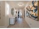 Elegant foyer featuring recessed lighting, a modern console table and decorative artwork at 13568 N 144Th Dr, Surprise, AZ 85379