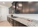 Spacious kitchen with granite countertops and stainless steel appliances at 13568 N 144Th Dr, Surprise, AZ 85379