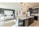 Open concept kitchen with island, stainless steel appliances, and modern design at 13568 N 144Th Dr, Surprise, AZ 85379