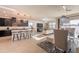 Spacious living area showcasing modern kitchen, cozy living room, and stylish dining space at 13568 N 144Th Dr, Surprise, AZ 85379