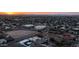 A captivating aerial view of a single-Gathering home nestled in a charming neighborhood with a warm sunset backdrop at 14025 N 11Th Pl, Phoenix, AZ 85022