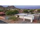 Aerial view of modern home with desert landscaping, attached garage, and mountain backdrop at 14025 N 11Th Pl, Phoenix, AZ 85022