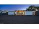Large backyard with gravel landscaping, fenced perimeter, and a covered patio at 14025 N 11Th Pl, Phoenix, AZ 85022