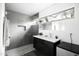 Modern bathroom features a sleek vanity, glass-enclosed shower, and natural light from the window at 14025 N 11Th Pl, Phoenix, AZ 85022