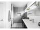 Sleek bathroom featuring a glass-enclosed shower, modern vanity, and stylish fixtures at 14025 N 11Th Pl, Phoenix, AZ 85022